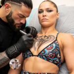 💥 BREAKING NEWS: Ronda Rousey Spotted Getting Tattoos “Near” Roman Reigns?! Fans Lose Their Minds! 💥